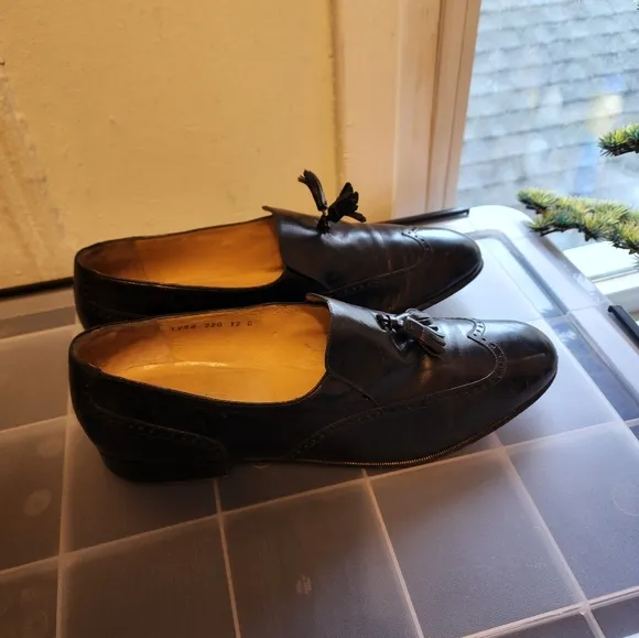 Salvator Ferrigamo men's black leather shoes.