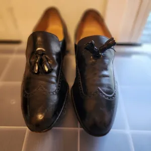 Salvator Ferrigamo men's black leather shoes.