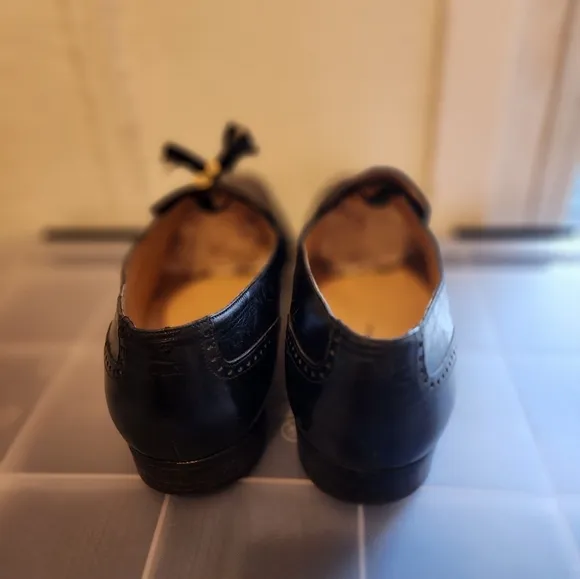 Salvator Ferrigamo men's black leather shoes.