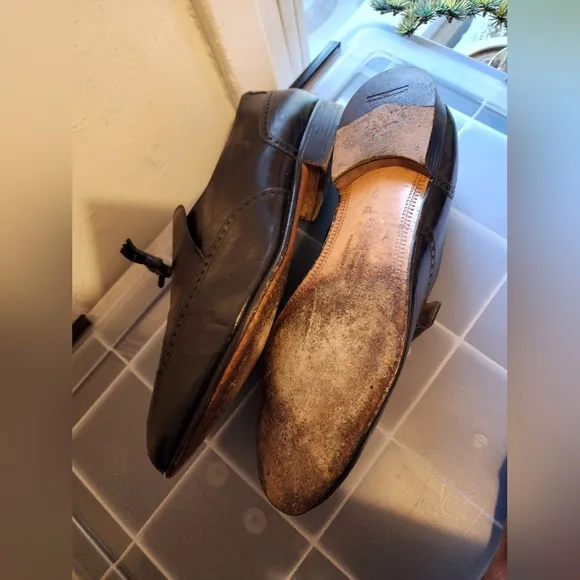 Salvator Ferrigamo men's black leather shoes.