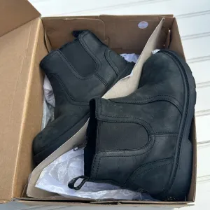 Ugg boots size 12 style T Bolden weather in black. like new in original box