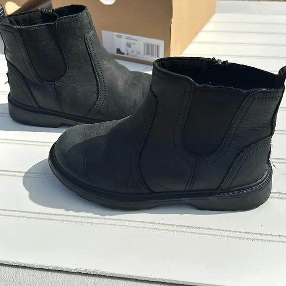 Ugg boots size 12 style T Bolden weather in black. like new in original box